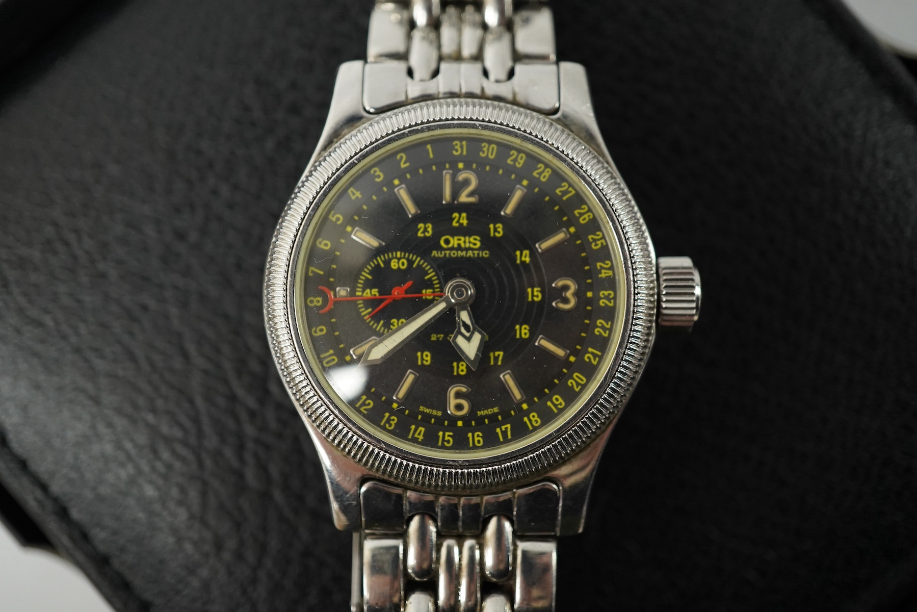 A gentleman's recent stainless steel Oris 640 Automatic wrist watch, with black dial, subsidiary seconds and Arabic and baton numerals, case diameter 36mm, on a stainless steel Oris bracelet, with receipt, box and papers
